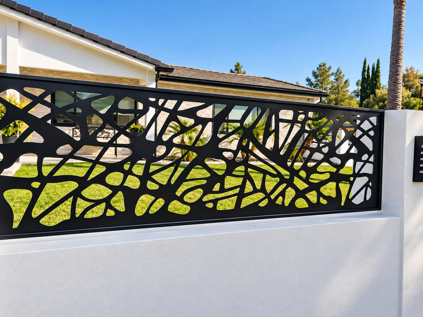 Contemporary black metal outdoor screen with sculptural cutouts